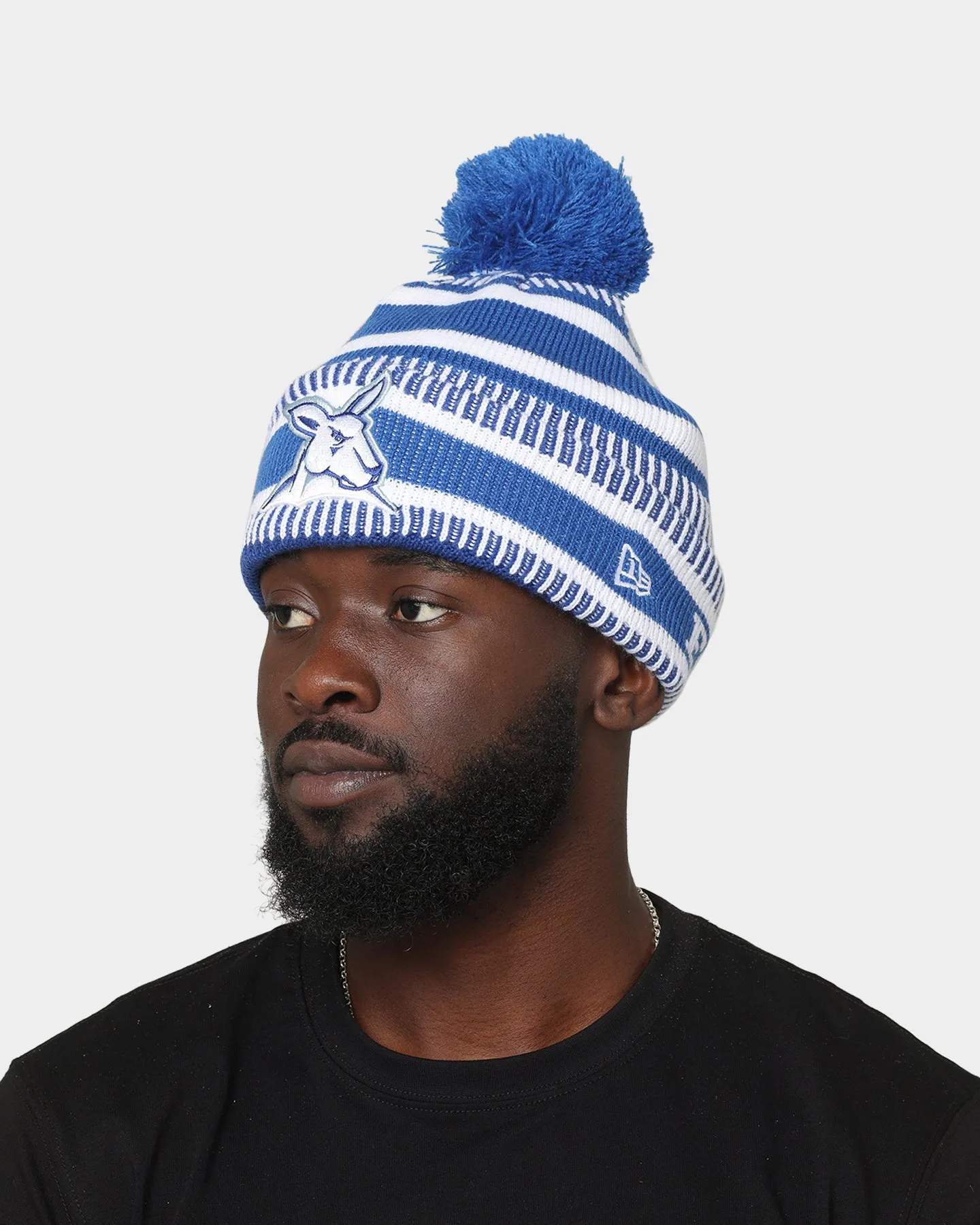 New Era North Melbourne Kangaroos AFL Opening Bounce 2022 Pom Wordmark Beanie Medium Blue